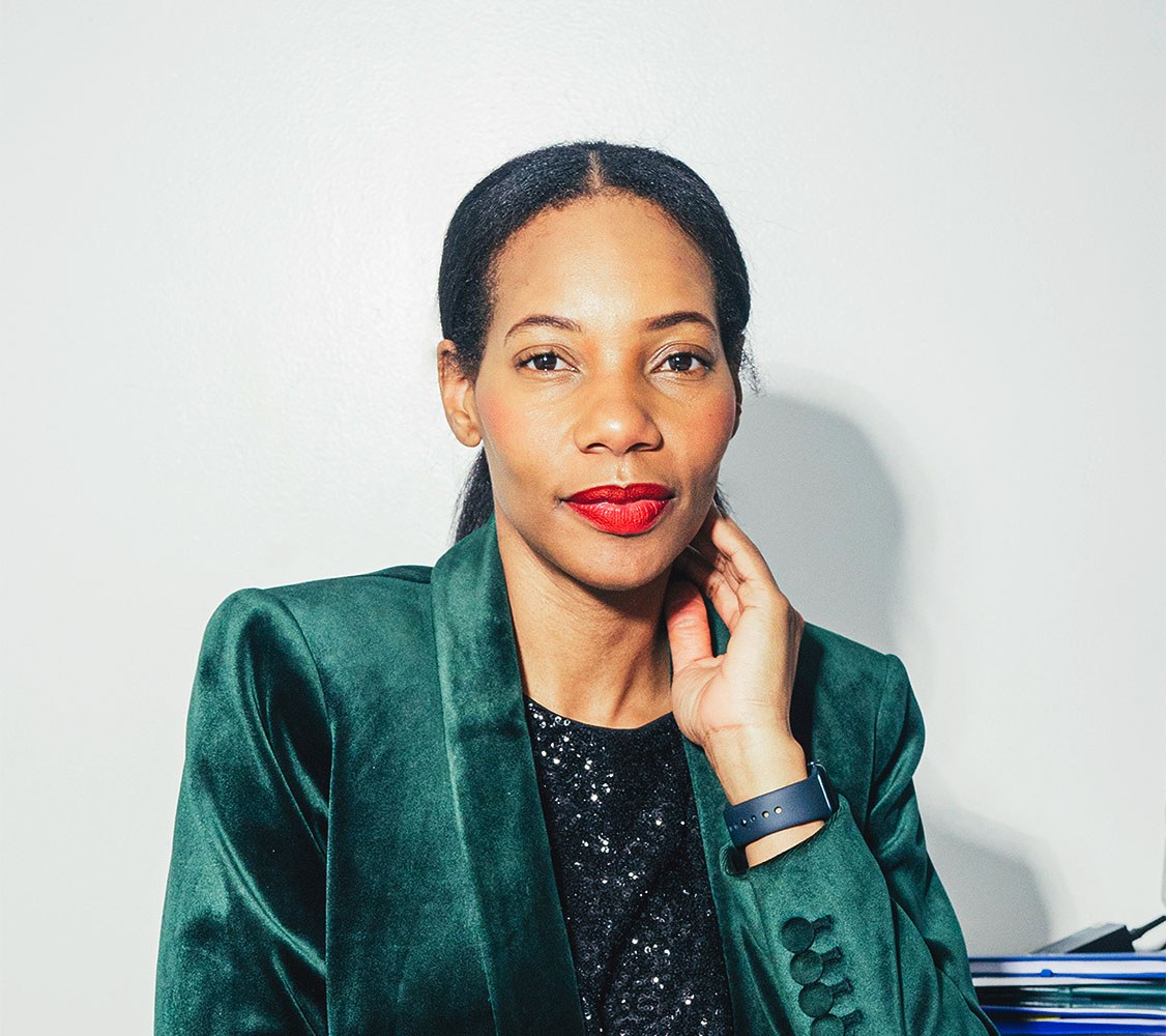 Portrait of Dianna Rose in front of a white wall