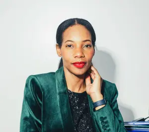 Portrait of Dianna Rose in front of a white wall